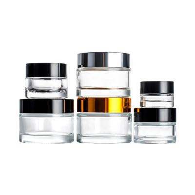 China Different Size Capacity Glass Cream Jar Face Cream Glass Jars Custom Cosmetic Container Cosmetic Jars With All Kinds Of Plastic Cap for sale