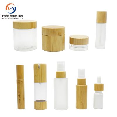 China 30ml 50ml 100ml 120ml 150ml Cosmetic Packaging Glass Bottles Bamboo Cosmetic Jars With Bamboo Spray Lotion Lid for sale