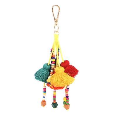 China 2021 Luxury Colorful Cotton Pendant Yarn Rainbow Tassels Key Chain HANSTON Boho Charm Wood Beaded Decorative Luggage Bag Key Chain Handbag for sale