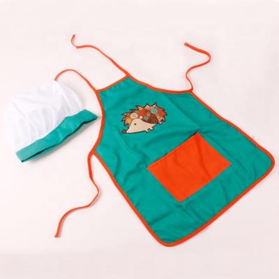 China Hot Selling Christmas Game Polyester Twill Fabric Cheap Cotton Material Kids Kitchen Apron With Hat Cooking Set With Hedgehog Pattern for sale