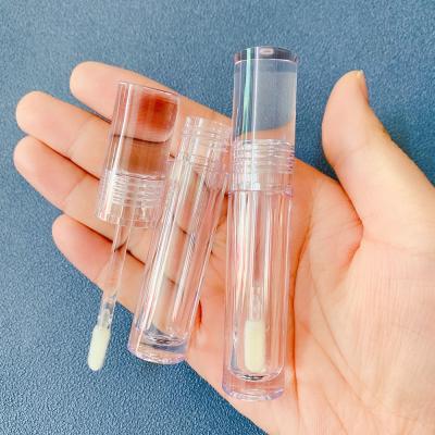 China 100pcs PETG Brand Cosmetic Cylinder Plane Crystals Lip Gloss Containers 4ml Full Clear Custom Packaging Lip Gloss Tubes With Flat Wand for sale