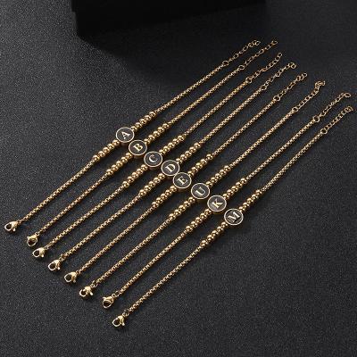 China 26 Letter Cute Hot English Gold Stainless Steel Round Supply FJ Titanium Steel Bracelet for sale