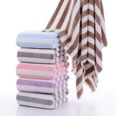 China Professional Manufacture Compressed Soft And Comfortable Super Absorbent Stripe Warp Knitted Velvet Coral Towel for sale