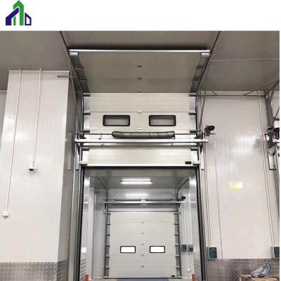 China JIANDA Industrial Automatic Industrial Sectional Overhead Door With Passing Gate for sale