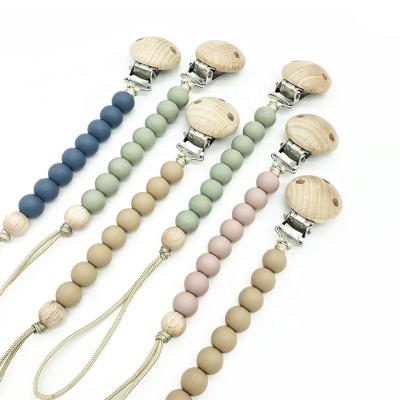 China Baby Free Wholesale Chewable Beaded Wooden Dummy Silicone Holder BPA Factory Soother Pacifier Chain Clip for sale