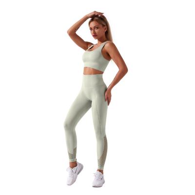 China Breathable OEM Accept Wholesale Two Pieces Yoga Set Hollow Fitness Leggings Set Seamless Workout Yoga Suit For Sportswear for sale