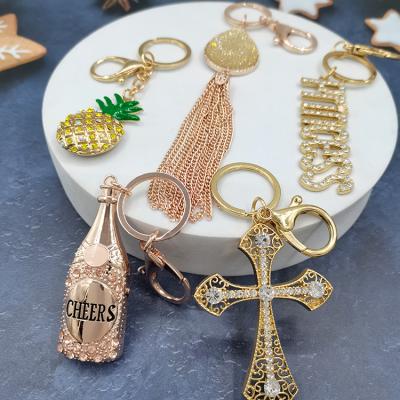 China Wholesale Promotion Gift New Design Wine Bottle Tassel Pineapple Enamel Letter Crown Key Chain Custom Cross for sale