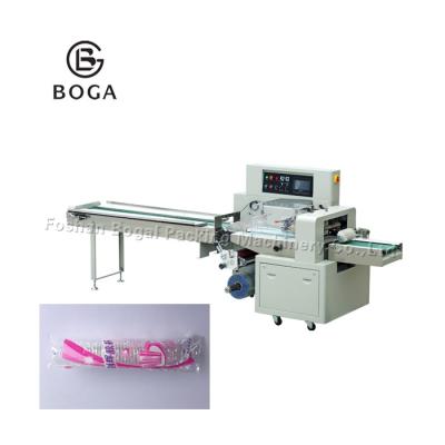 China Horizontal Flow Pack Machine Small Bag Servo Motor Disposable Cup Packing for sale