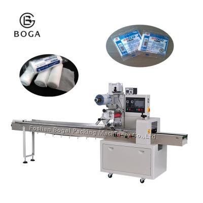 China Gauze Packing Machine Semi Automatic Film Wrapping Pillow Bag Making for sale