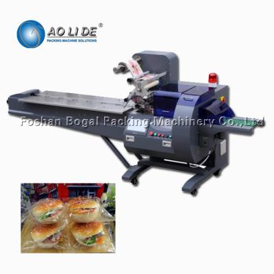 China Rotary type pillow disposable plastic tray walnut dried meat floss cup cake wrapper sealing packaging machine Te koop