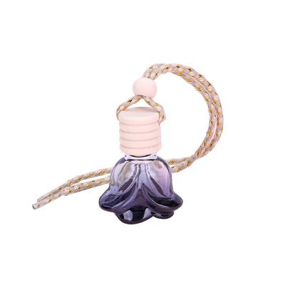 China Empty Round Personal Care Flower Pumpkin Car Perfume Hang Bottle Car Diffuser Perfume Bottle Black Glass Liquid for sale