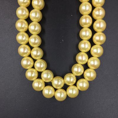 China Wholesale High Quality  14mm Golden  Round Shap Shell Pearl Strand 16 inches for sale