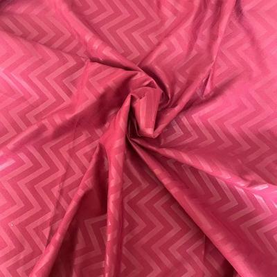 China Waterproof 100% Polyester Plain Dyed Microfiber Soft 3D Embossed Bed Sheet Fabric for sale