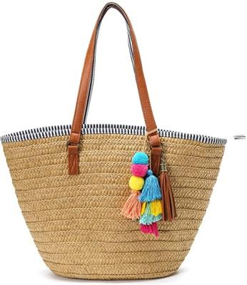 China Straw Beach Bags Tote Tassels Multifunctional Summer Hobo Bag Handwoven Shoulder Bags Purse With Pom Poms for sale