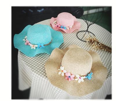 China Custom Spring and Summer Wide Brim Lightweight Floppy Ladies Flower Sun Hat Flower Beach Lovely Straw Floppy Hats for sale