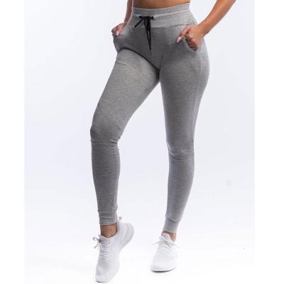 China Anti-Wrinkle Solid Color Women's Spring Pants Waisted Drawstring Ladies Sweatpants High Top Stacked Pants for sale