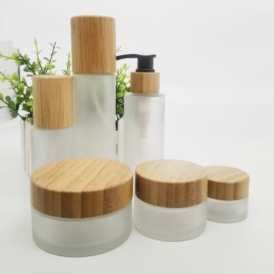 China 30ml Cosmetic Luxury 50ml 100ml 120ml 150ml Frosted Spray Rollerball Cosmetic Glass Perfume Bottle With Bamboo Cap Cosmetic Packaging for sale