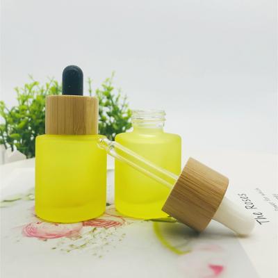 China Cosmetic High End Square Dropper Bottle 30ml 50ml Yellow Glass Dropper Bottle For Cosmetic Essential Oil for sale