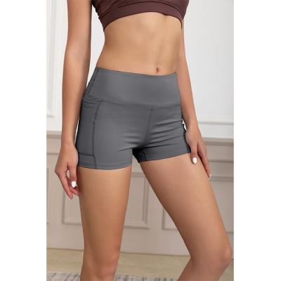 China Breathable Women's High Waist Yoga Shorts With Pockets Side Tummy Control Gym Workout Biker Shorts For Women à venda