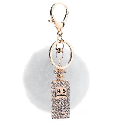 China Bag Decoration Metal Car Perfume Bottle Crystal Keychains Women Fur Ball Pendant Key Chains For Birthday Gifts for sale