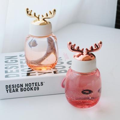 China Amazon Hot Sale Modern Christmas Glass Antler Color Changing Bottle for sale