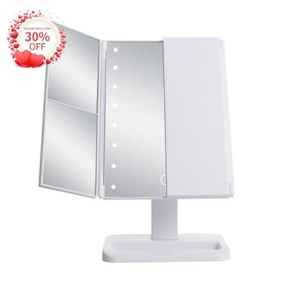 China HOT Popular Lit LED Light Screen Touch Makeup Mirror Tri Folded 1x 2x 3x Magnification Mirror Tray Cosmetic Vanity Mirror With Led for sale