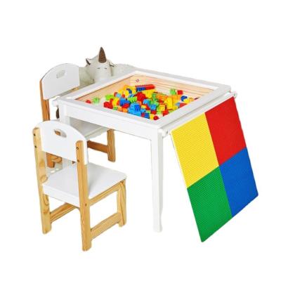 China Modern solid wood study desk with chairs storage box baby lego kids table and chair set lego table for sale