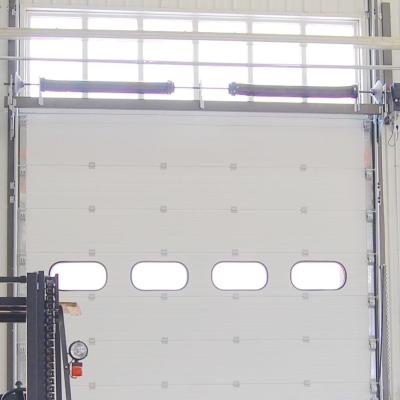 China Wind Load Max 55m/S Industrial Sectional Doors Surface Embossing Anti Breaking for sale