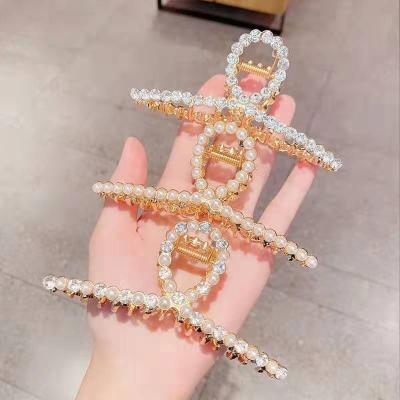 China Phone line form 2021 fashionable new faux stone pearl metal texture head hair claw hair claw cllips big Korean zinc alloy grab clip for sale