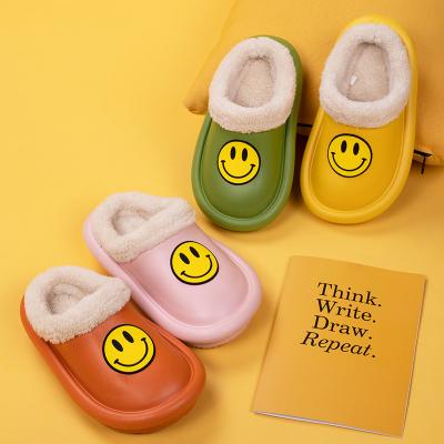 China Winter Face Women Slippers Children's Height Increasing Lovely Boys and Girls Smile Home Waterproof Warm Thick Bottom Baby Plush Cotton Slippers for sale