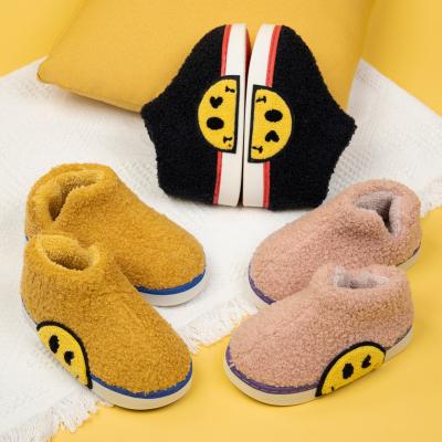 China 2021 Children's slippers durable autumn/winter home indoor girl cute smile boy face thick bottom with plush cotton slippers for sale