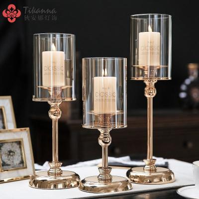 China Luxury Romantic Hotel Wedding Birthday Candlestick Home Decoration Around Clear Bottom Windproof Crystal Glass Hurricane Candle Holder Gold for sale