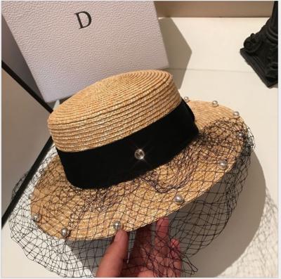 China COMMON pearl gauze flat surface and flat brim wheat straw parasol hat women travel straw hat in spring and summer for sale