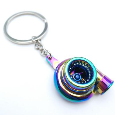 China Rainbow Turbo Key Chain Six Gear Gearbox Main Chain Wheel Portable Spinning Tire Rim Keychain for sale