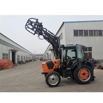 China Cultivates the front of the agricultural tractor is equipped with a grass grabber, and the modified grass grabber grabs a fork wooden tractor for sale