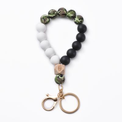 China 2022 Personalized Elastic Beaded Keychains Environmentally Friendly Wooden Silicone Wristband Keychains for sale