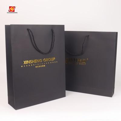 China 2022 Hot Sale Recycled Materials Brown Twisted Carrier Shopping Bag With Handle Wedding Packaging Recyclable Jewelry Boutique Kraft Paper Gift Bags for sale