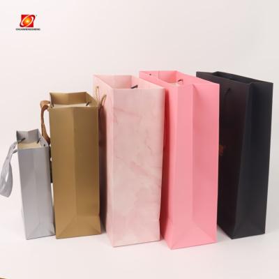 China 2022 Hot Selling Customized Black Recycled Paper Packaging Materials Wholesale With Handles Design Bag for sale