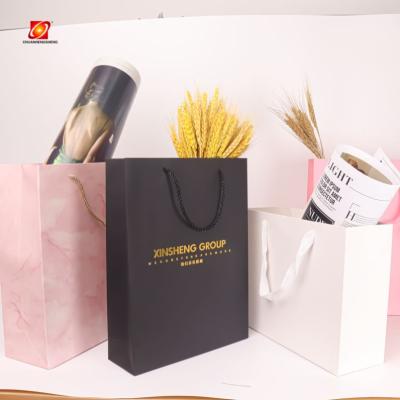 China Recycled Materials Multifunctional Gift Bags 2021 Hot Sale Craft Custom Paper Shopping Bag for sale