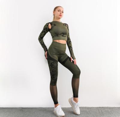 China QUICK DRY Border Seamless Camouflage Hip High Waisted Yoga Pants Women Hollow Tights Running Sports Fitness Pants for sale