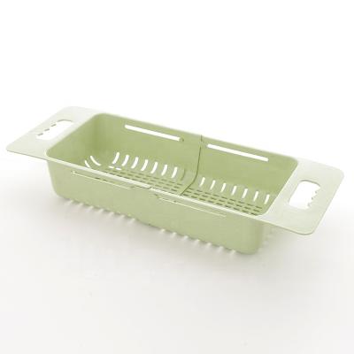 China Sustainable Kitchen PP And Wheat Straw Material Elastic Expand Adjustable Sink Basket For Dishes Vegetables for sale