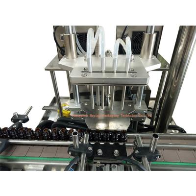 China Automatic Small Food Bottle Perfume Packing Line Small Liquid Filling Machine With Vacuum for sale