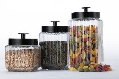 China set of three glass canisters with metal lids ,different size and various colors  for storing for sale