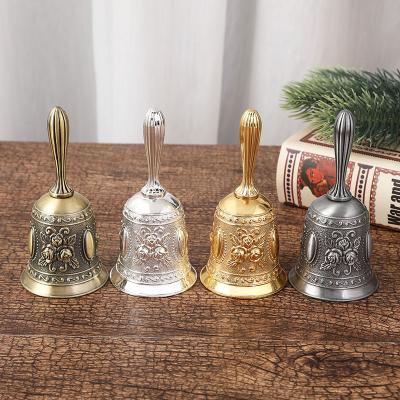 China Europe Fashion Metal Hand Nordic Golden Service Bell For School Restaurant for sale