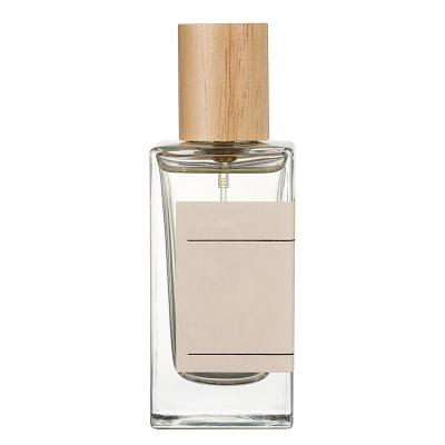 China Cosmetic In Stock 50ml Rectangle Perfume Bottles Glass Perfume Bottles With Wooden Cap for sale