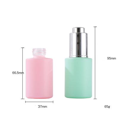 China 30ml 1oz Essential Oil Bottle Cosmetic Skin Care Pump Bottle Green Glass Airless Airless Dropper Bottles With Press Dropper for sale