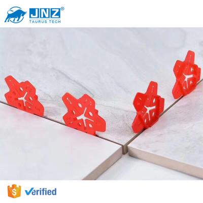 China Modern Reusable JNZ Tile Spacer Five Sizes Tile Leveling System Tool Plastic Red Pentagram Tile Spacer for sale