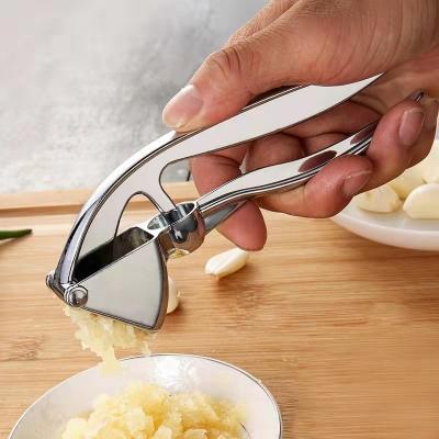 China Sustainable Success Kitchen Instruments Stainless Steel Garlic Press Vegetable Peeler Tools Manual Garlic Press and Slicer for sale