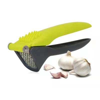 China Viable Professional Kitchenware Vegetable Tools Wholesale Stainless Steel Garlic Press Crusher Garlic Crusher for sale