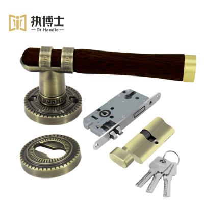 China Easy Installation Dr.Handle New Design Furniture Handle Combine Soild Wood And Lock Brass Door Handle For Bedroom for sale